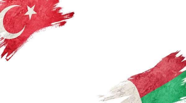 Flaggen der Türkei und Madagaskars auf weißem Hintergrund — Stockfoto